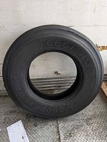 Full view of Goodyear G661 HSA tire standing upright