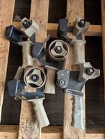 All six packing tape dispensers grouped on pallet
