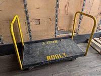 Full view of cart showing deck, both handles and overall wear