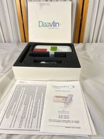 Open Daavlin box showing device, comb, cord, foam insert