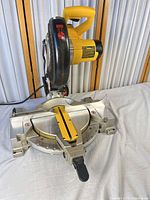 Full view of DEWALT DW713 miter saw on table