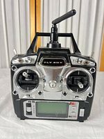 Front view of FlySky FS-T6 transmitter showing sticks, screen, controls