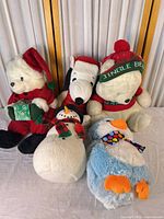Group shot of all five holiday plush