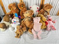 Group shot of ten assorted plush toys