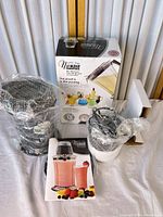 Boxed NuWave Party Mixer blender with wrapped components and manual