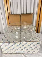 Chip & dip bowl resting on branded box, overall view