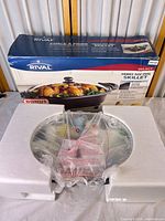 Box front showing Rival Select Family Size Oval Skillet imagery and specs