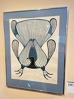 Framed print on wall showing full artwork, frame, mat