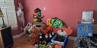 Overall lot with inflatables, tinsel pumpkin, skull containers, string lights