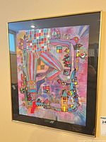 Full view of framed mixed media artwork on wall