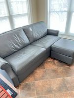 Sofa and ottoman together showing size and color