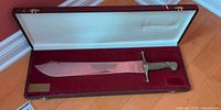 Machete inside open fitted case showing full view