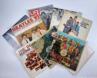 Group shot of entire lot showing multiple Beatles LPs and Life magazine