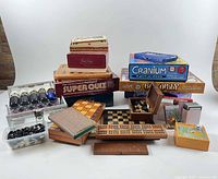 Overall lot showing all boxed board games, wooden boards, pieces and accessories