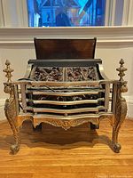 Full front view of electric fire basket showing overall design, grate and legs