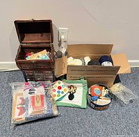 overall lot showing sewing box, yarn box, fabric bag, tin and notions
