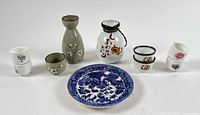 Group shot showing all sakeware pieces and plate