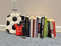 All 13 soccer books lined together showing spines and covers