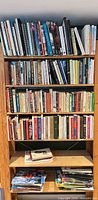 Full view of bookcase with books on all shelves