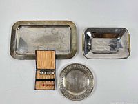 group shot of all items: 3 trays and boxed spoons