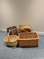 group of four visible wicker baskets showing variety of colors and shapes