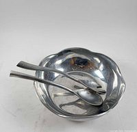Mariposa Brillante aluminum bowl with spoon and fork inside