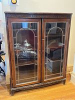 Full view of Honderich glass front bookcase showing design and overall condition