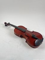 Full view of violin front lying flat