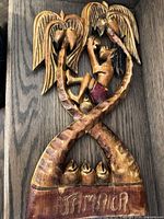 Front view showing entire carved plaque with inscription