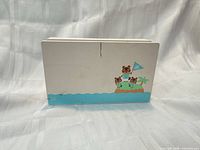 Front view showing Tom Nook island artwork on off-white dock