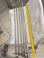 Top view showing five bars and measuring tape indicating approx 27 in width