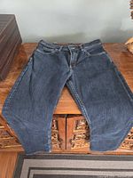 Full view of jeans laid flat