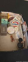 Overview of tray showing mixed fly-fishing supplies