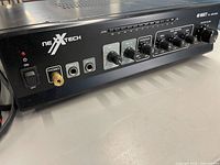 Front panel showing Nexxtech branding, inputs, and control knobs