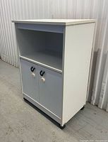 Front view of cabinet with doors closed