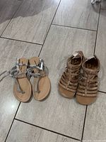Both pairs of sandals side by side