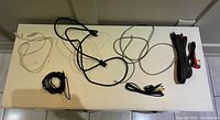 All seven cables laid out on surface