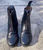 Top view of both boots showing zipper front, cap toe and leather condition