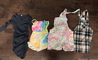 Four garments laid flat showing full view