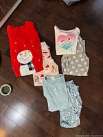All three pajama sets laid out on floor