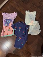 Overall view of the five sleepwear pieces laid out