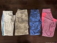 Four pairs of pants laid flat side-by-side