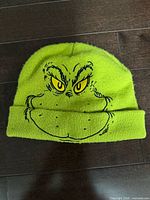 Front view of neon green Grinch winter toque