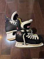 Side view of both CCM Cyclone 90 skates showing uppers, holders and runners