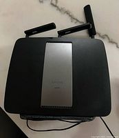 Top view showing Linksys EA9200 branding and six antennas