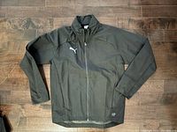 Front view of black Puma coat