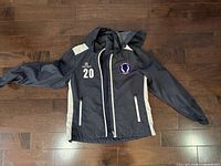 Front view showing color, number 20, logo patch, pockets and hood