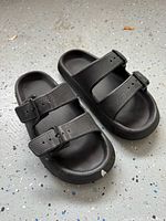 Top view of black two-strap slide sandals