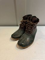 Three-quarter front view of both boots showing overall style and condition
