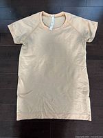 Front view of orange Lululemon shirt